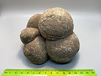 a stack of 5 rounded ball-shaped concretions.